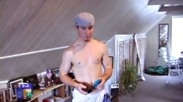 Cory Woodall watches a porn video, while standing by his skateboard. The camera takes us on a sexy tour of Cory's body, which looks cuter than ever. Seen from the ground, this boy's balls are fucking huge.
