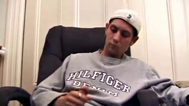 While playing a porn video, Aaron strokes himself hard and then pulls his dick out of his jeans. After a good long stroking show, this young man lets loose and spills his hot sticky cum all over the bed.