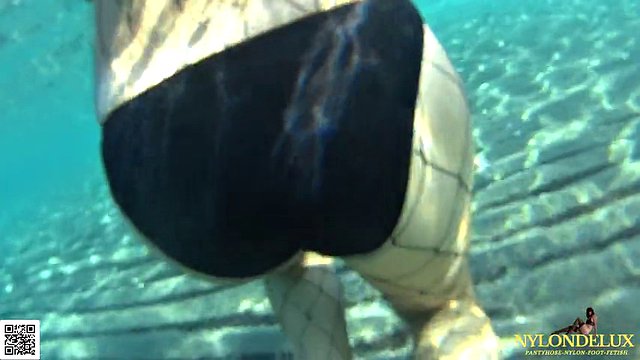 fishnet stocking in public sea and beach
