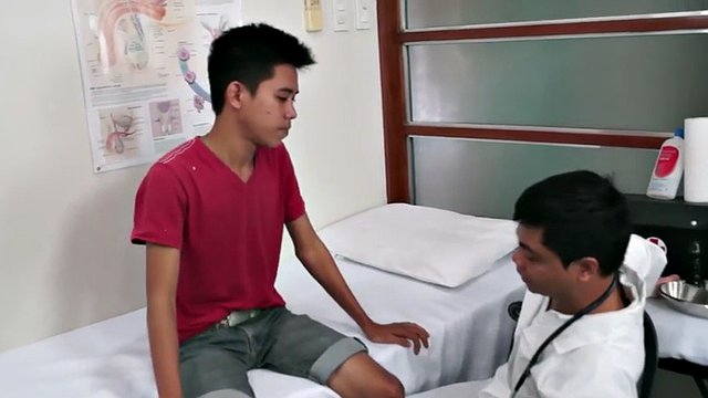 Asian doctor in uniform fingering and toying twinks ass