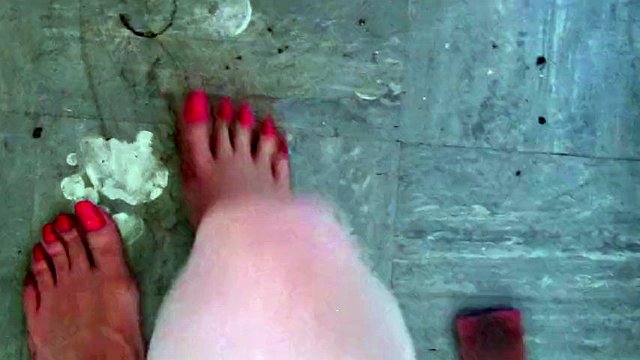 Sissy scrubs a dirty kitchen floor with spit and her feet