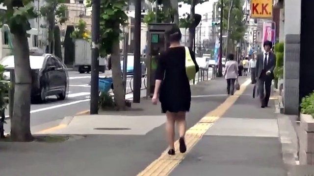 Nasty japanese babe caught while taking a pee in public