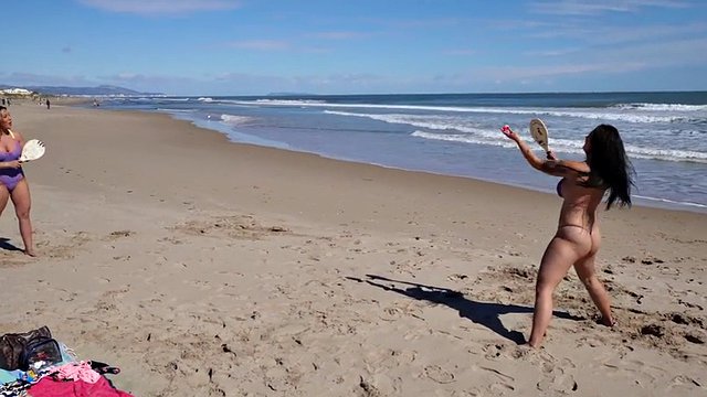 Big ass bikini lovers play beach tennis