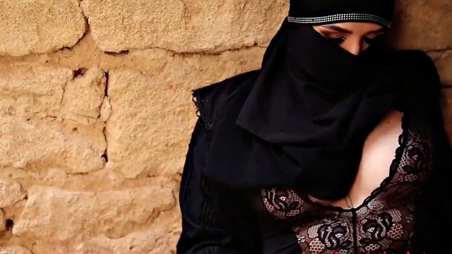 Very hot arab girl in a hijab smoking