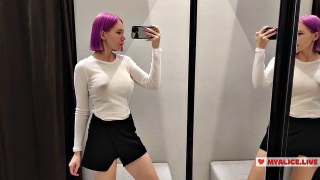 Try on transparent clothes in the fitting room. Busty blonde tries on a transparent blouse with only panties