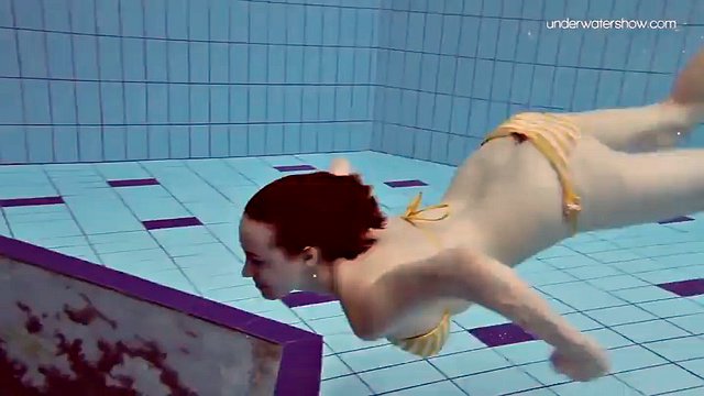 Teen Lada with small tits naked underwater