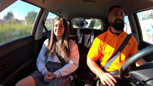 Doggystyled driving student enjoys class