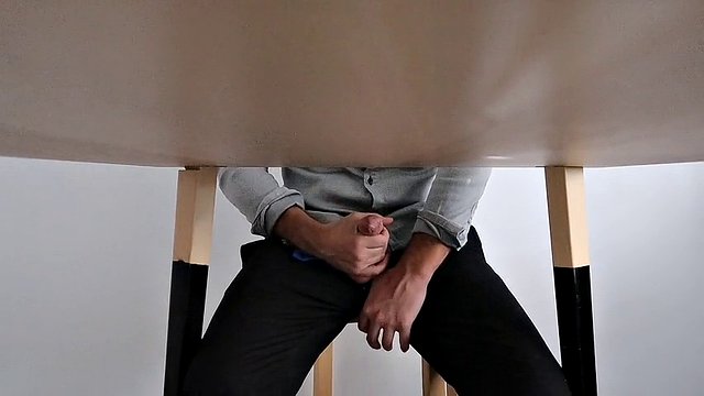 I catch my office colleague masturbating under the table and