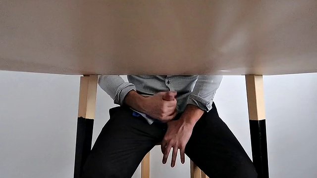 I catch my office colleague masturbating under the table and