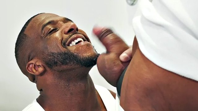 A black hunk with his fist fucks a skinny and greedy gay with his foot