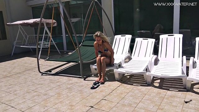 Russian porn star Mary Kalisy swims naked in the pool