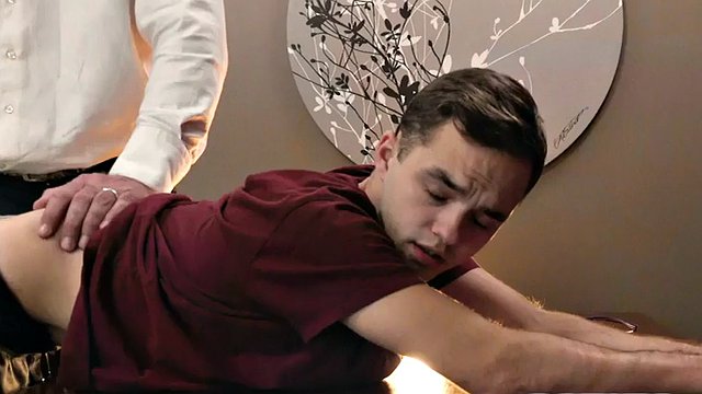 Petite twink plays with his ass with help from DILF's HJ in the office