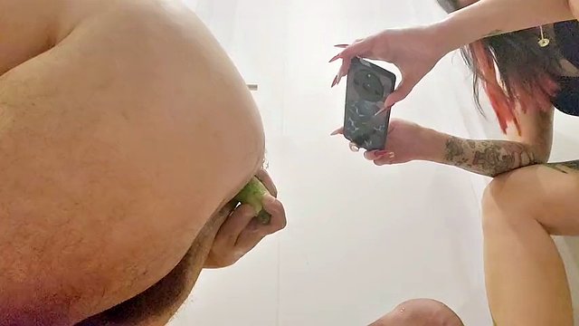 Ginger and big vegetable anal plug in the ass. Food fetish in the ass. Dominatrix puts ginger and eggplant in a slave's ass