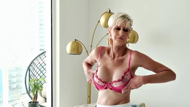 Meet Foxy, a 60 year old wife, MILF and GILF with big tits and a pierced clit