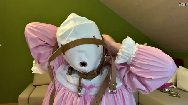 Sissy in diaper with bondage hood