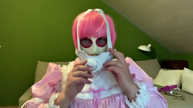 Sissy in diaper with bondage hood