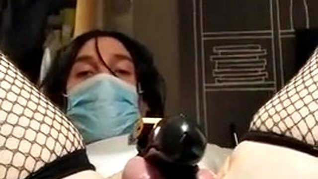 Hot brunette transwoman gets double anal fucked while locked in chastity belt