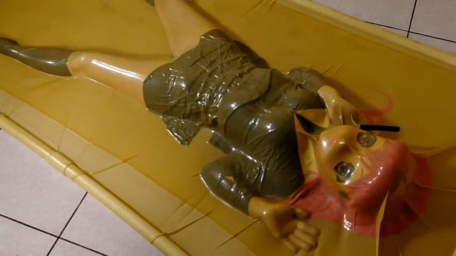 kigurumi vibrating in vacuum bed