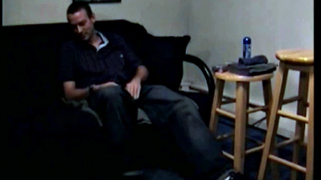 After the straight porn starts, Troy strips naked and starts jerking off his cock while the camera explores all the nooks and crannies of his body.